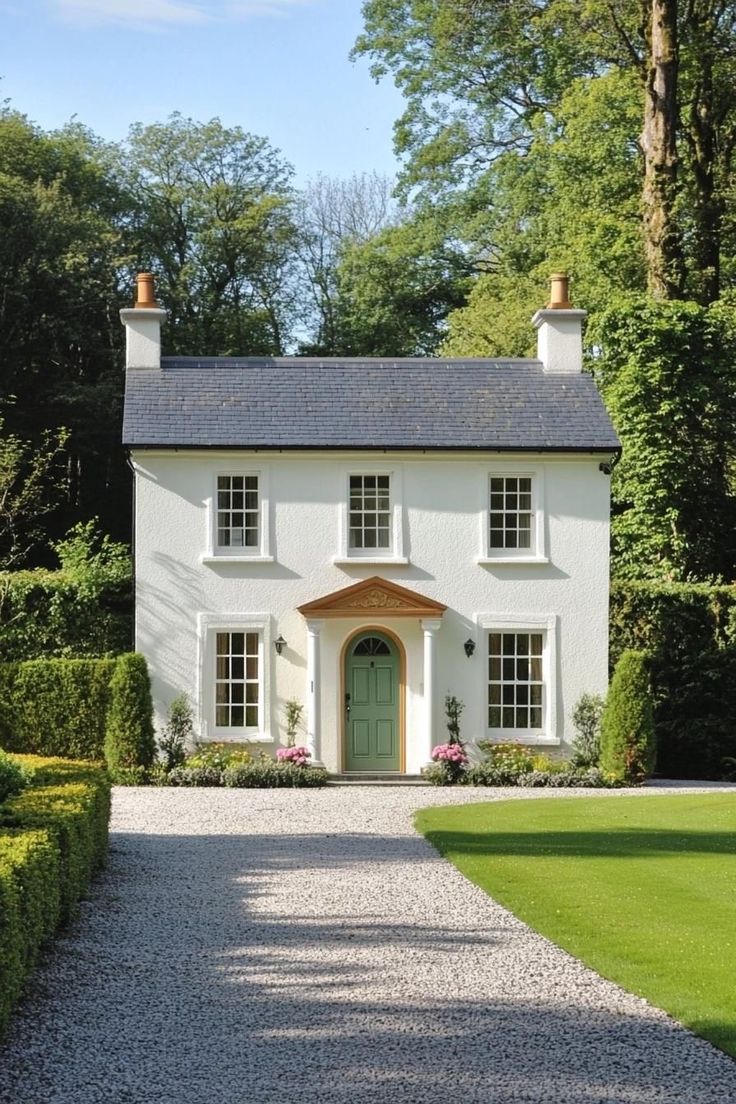 White rendered UK cottage with clean roofline underside